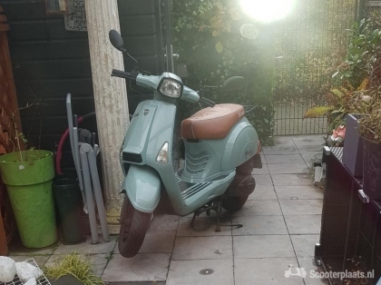 Retro scooter blauw